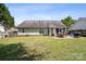Large backyard featuring a patio, green lawn, a privacy fence and mature trees at 8105 Castlemaine Dr, Matthews, NC 28104