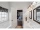 Bright bathroom featuring a large soaking tub, double sink and an entrance into the main bedroom at 8105 Castlemaine Dr, Matthews, NC 28104