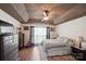 Spacious bedroom featuring a tray ceiling, wood floor, and natural light from a large window at 8105 Castlemaine Dr, Matthews, NC 28104