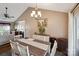 Beautiful dining area adjacent to the living room features hardwood floors and natural light at 8105 Castlemaine Dr, Matthews, NC 28104