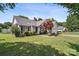 Charming home with mature landscaping and a well-manicured lawn at 8105 Castlemaine Dr, Matthews, NC 28104