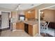 Well-appointed kitchen with tile backsplash, granite counters, and an open view to dining area at 8105 Castlemaine Dr, Matthews, NC 28104