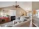 Cozy living room featuring a fireplace, a ceiling fan, and an open layout to the dining area at 8105 Castlemaine Dr, Matthews, NC 28104