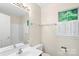 Bathroom featuring a window, single vanity, and white shower at 8302 Holbrook Square Ct, Charlotte, NC 28216