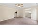 Bedroom featuring closet with wire shelving, a ceiling fan and neutral color scheme at 8302 Holbrook Square Ct, Charlotte, NC 28216