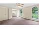 Spacious bedroom with neutral carpet, ample closet space and natural light from windows at 8302 Holbrook Square Ct, Charlotte, NC 28216