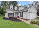 Beautiful home with light gray siding, a well-manicured lawn, and charming curb appeal at 8302 Holbrook Square Ct, Charlotte, NC 28216