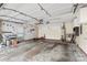 Spacious two car garage featuring plenty of storage space for tools and other supplies at 8302 Holbrook Square Ct, Charlotte, NC 28216