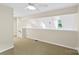 A loft featuring a sloped ceiling and neutral decor at 8302 Holbrook Square Ct, Charlotte, NC 28216