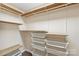 Walk-in closet offering shelving and metal basket storage for optimal organization at 8302 Holbrook Square Ct, Charlotte, NC 28216