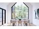 Bright dining room with a large picture window, modern table, and ample seating at 866 Concord Rd # 1C, Davidson, NC 28036