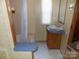 A full bathroom includes a vanity and a shower with a neutral color scheme at 868 Alexis High Shoals Rd, Dallas, NC 28034