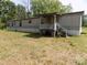 Exterior view of single-story home with a covered front porch at 868 Alexis High Shoals Rd, Dallas, NC 28034