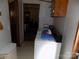Utility area equipped with a washer, dryer, and ample storage solutions at 868 Alexis High Shoals Rd, Dallas, NC 28034