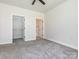 Bedroom featuring neutral walls, carpet flooring, and a closet providing a functional and adaptable living space at 8747 Coralbell Ln, Charlotte, NC 28213
