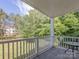 Inviting outdoor patio area with a table, perfect for relaxation and enjoying the view at 8747 Coralbell Ln, Charlotte, NC 28213