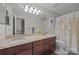 This bathroom features double sinks, vanity, and a shower to get you squeaky clean in the morning at 9001 Peyton Randolph Dr, Charlotte, NC 28277