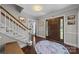 Inviting foyer features a wood front door with glass and sidelights and stairs at 9001 Peyton Randolph Dr, Charlotte, NC 28277