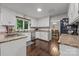 Well-lit kitchen with white cabinetry, granite countertops, and stainless steel appliances at 9001 Peyton Randolph Dr, Charlotte, NC 28277