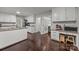 Spacious kitchen with granite counters, white cabinets, wood floors, and stainless steel appliances at 9001 Peyton Randolph Dr, Charlotte, NC 28277