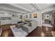 Open-concept living area with wet bar, fireplace, and comfortable seating at 9001 Peyton Randolph Dr, Charlotte, NC 28277