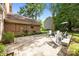 Stone patio area with Adirondack chairs, fire pit, and nice backyard landscaping at 9001 Peyton Randolph Dr, Charlotte, NC 28277