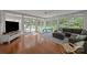 Bright sunroom with hardwood floors, plenty of windows, and comfortable seating at 9001 Peyton Randolph Dr, Charlotte, NC 28277