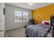 Cozy bedroom featuring natural light, carpet flooring, and a black chaise lounge at 9132 Colwick Hill Ln, Charlotte, NC 28215