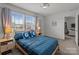 Bright bedroom with a large window, wooden furniture, and cozy bedding for a comfortable retreat at 9132 Colwick Hill Ln, Charlotte, NC 28215