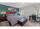 Comfortable bedroom featuring a window, nightstands, a comfortable bed, and a computer desk at 9132 Colwick Hill Ln, Charlotte, NC 28215