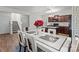Dining room featuring an open kitchen, modern table set, and stylish chandelier at 9132 Colwick Hill Ln, Charlotte, NC 28215