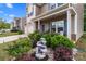 Inviting front yard with a decorative fountain, vibrant flowers, and lush greenery enhancing curb appeal at 9132 Colwick Hill Ln, Charlotte, NC 28215
