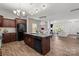Stylish kitchen featuring granite countertops, stainless steel appliances, and seamless connectivity to the dining and living areas at 9132 Colwick Hill Ln, Charlotte, NC 28215