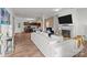 Open-concept living room featuring a fireplace, TV, and seamless flow into the kitchen and dining areas at 9132 Colwick Hill Ln, Charlotte, NC 28215