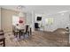 Spacious living area with modern finishes, connecting the dining area and creating a seamless, stylish space at 9132 Colwick Hill Ln, Charlotte, NC 28215