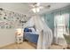 Floral bedroom showcases a canopy bed and vibrant wallpaper accents at 916 Cadogan Ct, Fort Mill, SC 29708