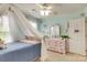 Bedroom includes a four-poster bed, dresser, and soft natural lighting at 916 Cadogan Ct, Fort Mill, SC 29708