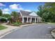 Exterior view of brick clubhouse with white columns, landscaping, and paved walkway at 916 Cadogan Ct, Fort Mill, SC 29708