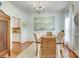 Bright dining room features hardwood floors, neutral walls, and a dining table for six at 916 Cadogan Ct, Fort Mill, SC 29708