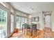 Sunlit dining room features large windows with views of the backyard and modern light fixture at 916 Cadogan Ct, Fort Mill, SC 29708