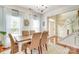 Charming dining room featuring natural lighting, hardwood floors, and an entrance to the foyer at 916 Cadogan Ct, Fort Mill, SC 29708