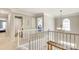 Upstairs hallway with natural light and access to bedrooms and bathrooms at 916 Cadogan Ct, Fort Mill, SC 29708