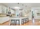 Well-lit kitchen with granite island and bar stool seating at 916 Cadogan Ct, Fort Mill, SC 29708