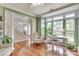 Inviting living room with hardwood floors, large windows, and adjacent to a staircase at 916 Cadogan Ct, Fort Mill, SC 29708