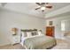 Serene main bedroom features a tray ceiling, neutral decor, and ample natural light at 916 Cadogan Ct, Fort Mill, SC 29708
