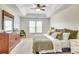 Spacious primary bedroom with tray ceiling, large windows and neutral decor at 916 Cadogan Ct, Fort Mill, SC 29708