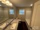 Bathroom showcasing a granite-topped vanity, a modern sink, and a shower-tub combination at 003 West Ave, Wadesboro, NC 28170