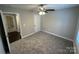 Cozy bedroom with soft carpeting, a ceiling fan, and a neutral color palette at 003 West Ave, Wadesboro, NC 28170