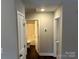 Hallway leading to a bathroom and bedroom with modern fixtures and clean finishes at 003 West Ave, Wadesboro, NC 28170