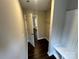 Hallway features hardwood floors, built-in seating with coat rack, and access to closet/laundry area at 004 West Ave, Wadesboro, NC 28170